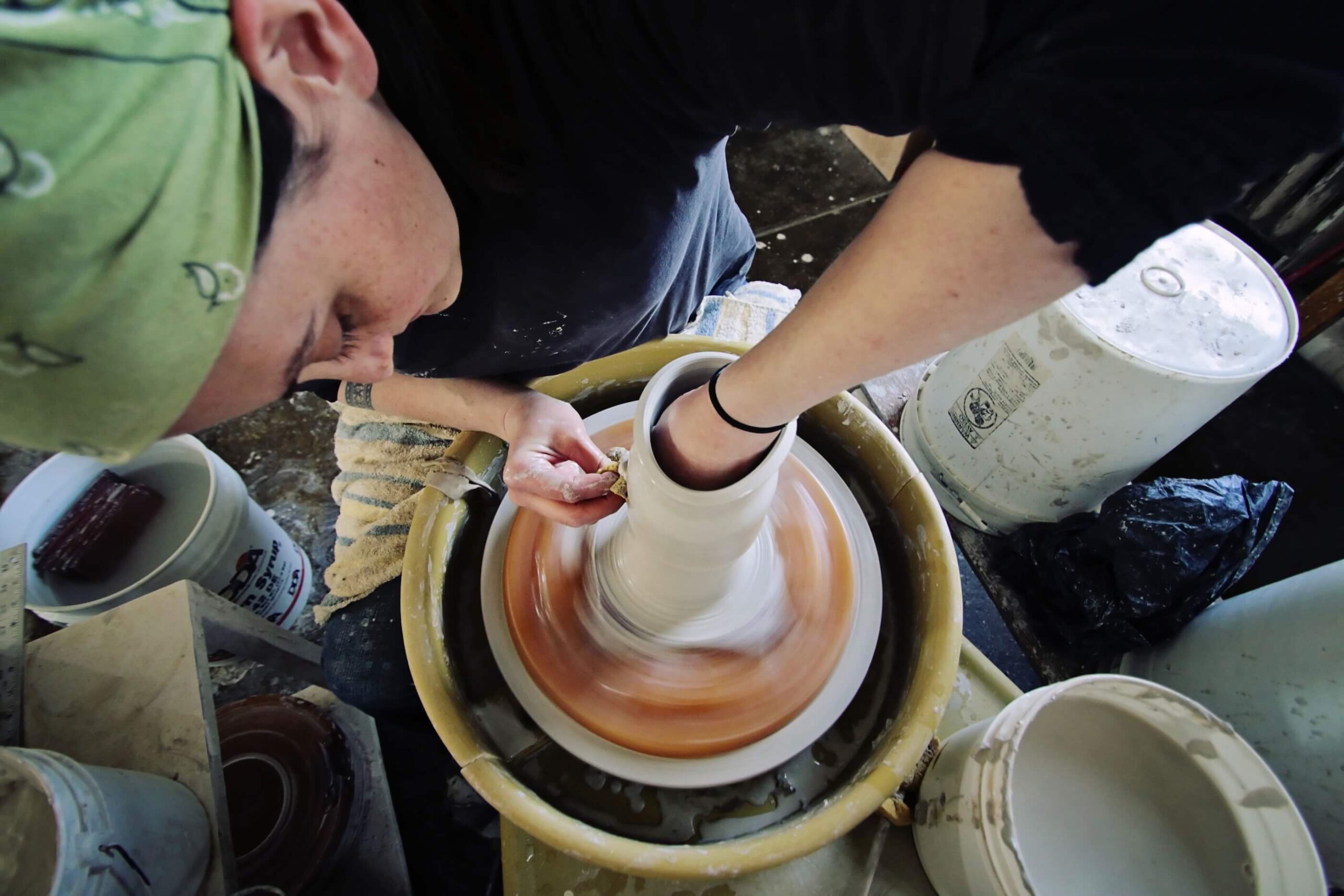 Women working on a pottery wheel